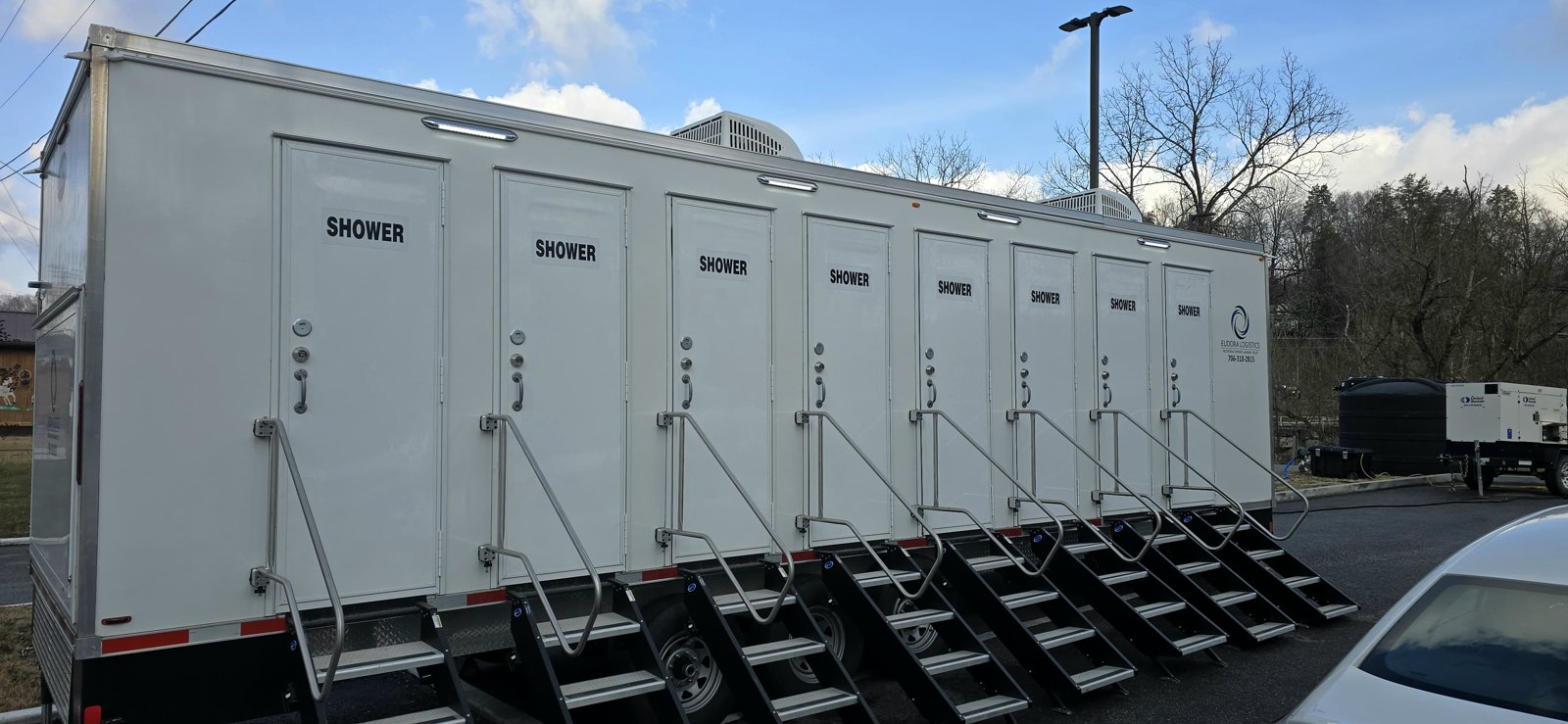 Shower trailer rental set up and leveled on a Utah work site