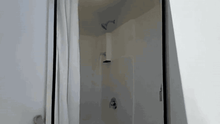 Looping tour inside a Utah shower trailer showing private shower stalls, vanity and finished interior